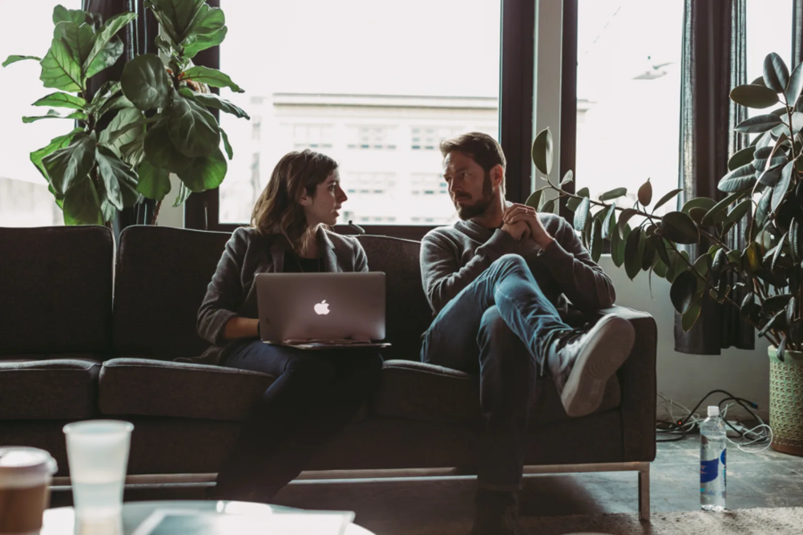 Two HumanSide colleagues working through a real task together at a laptop.